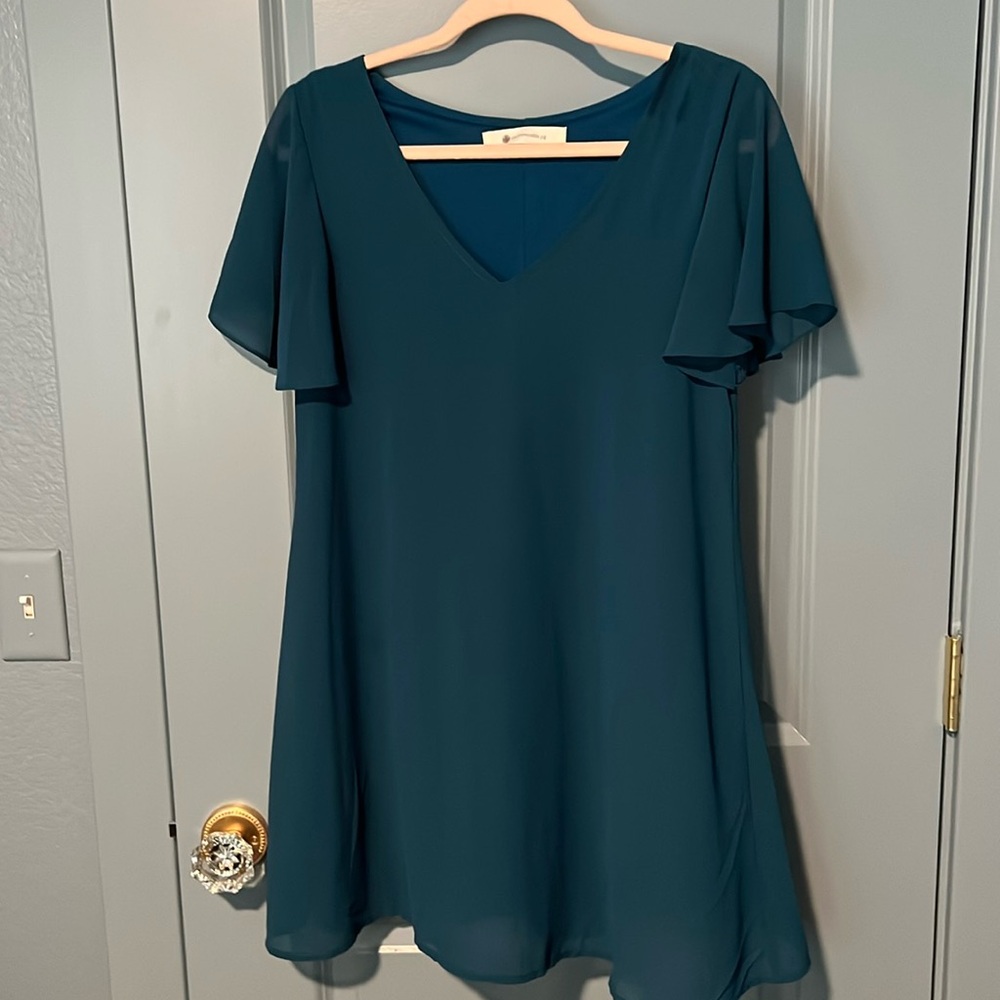Light and flowy teal blue dress. V-neck flutter sleeves. Size small